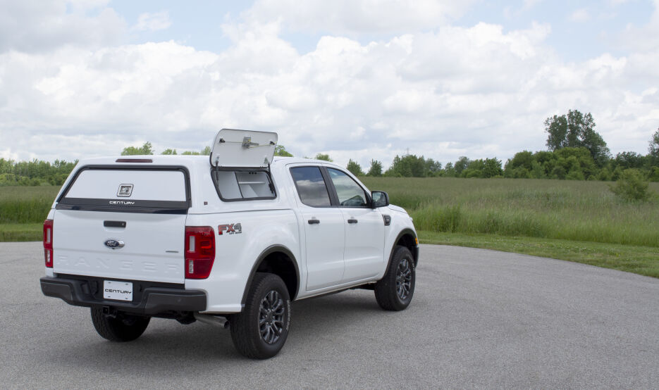 CenturyUltra-SCC-Ford-2019-Wht-Rr-Dr-Open-GrassyField-B.jpg