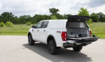 CenturyUltraSCC-SmoothSide-BedSlide-Ford-2019-Wht-Rr-Dr-GrassyField-C.jpg