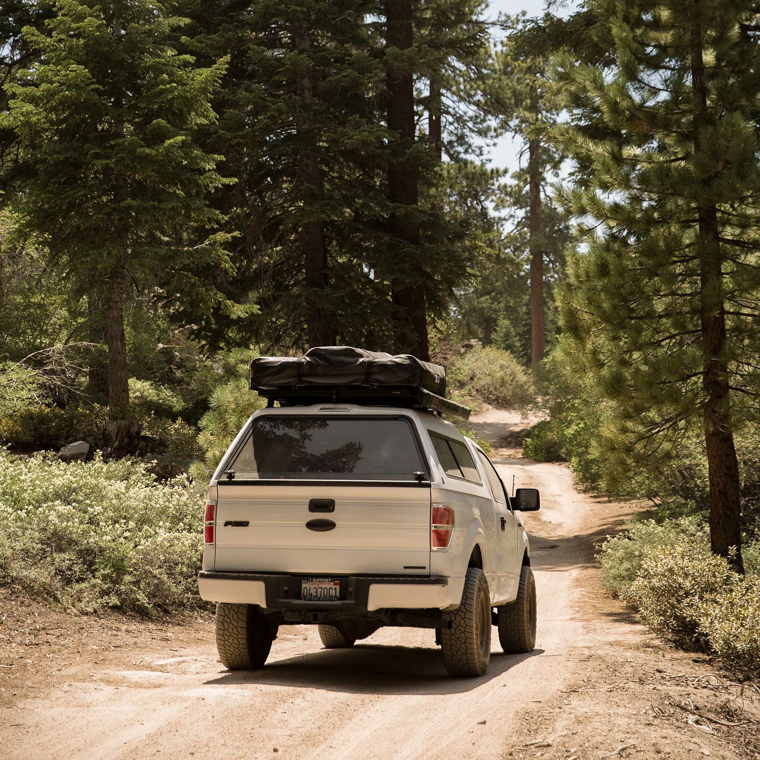 LEER fiberglass truck cap for camping and overland travel