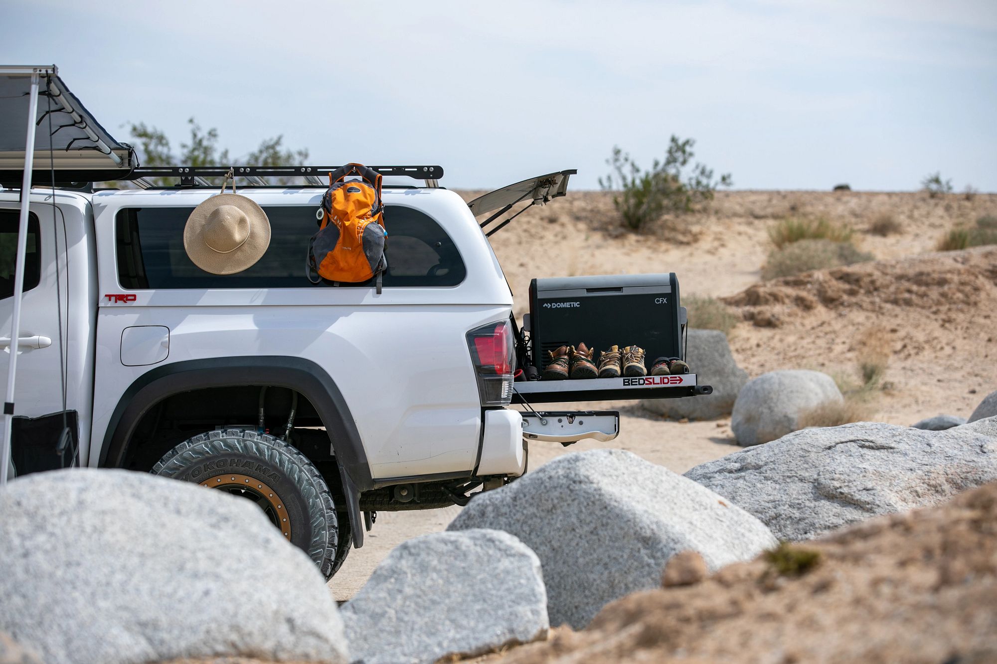 SNUGTOP Super Sport fiberglass truck cap on an adventure-ready pickup truck