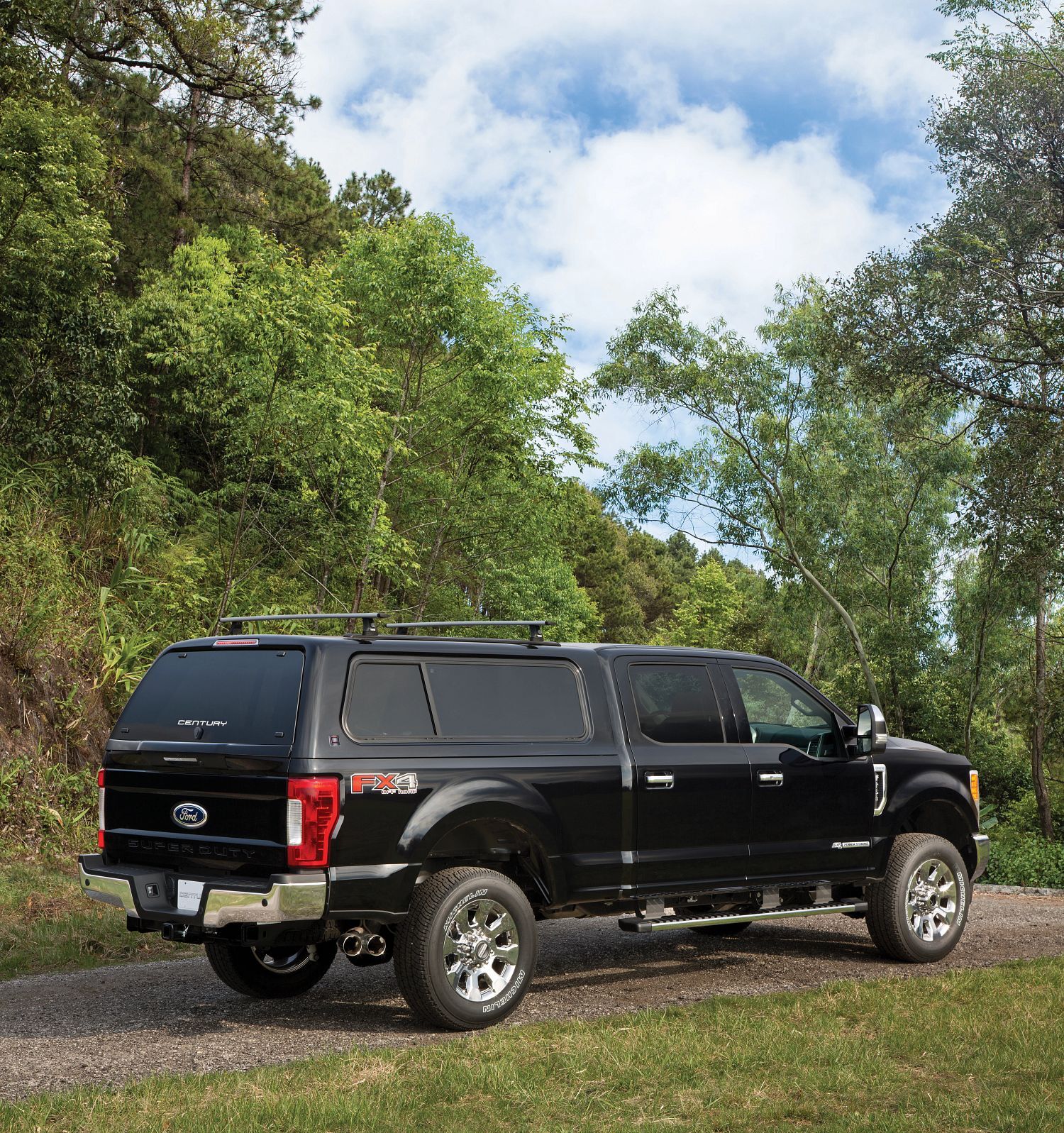 Century Ultra Sport fiberglass truck cap on a Ford F-250 outdoors
