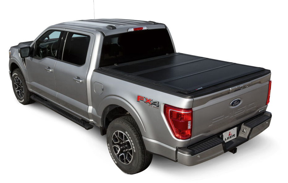 LEER HF350M hard tri-fold tonneau cover installed on a silver Ford F-150