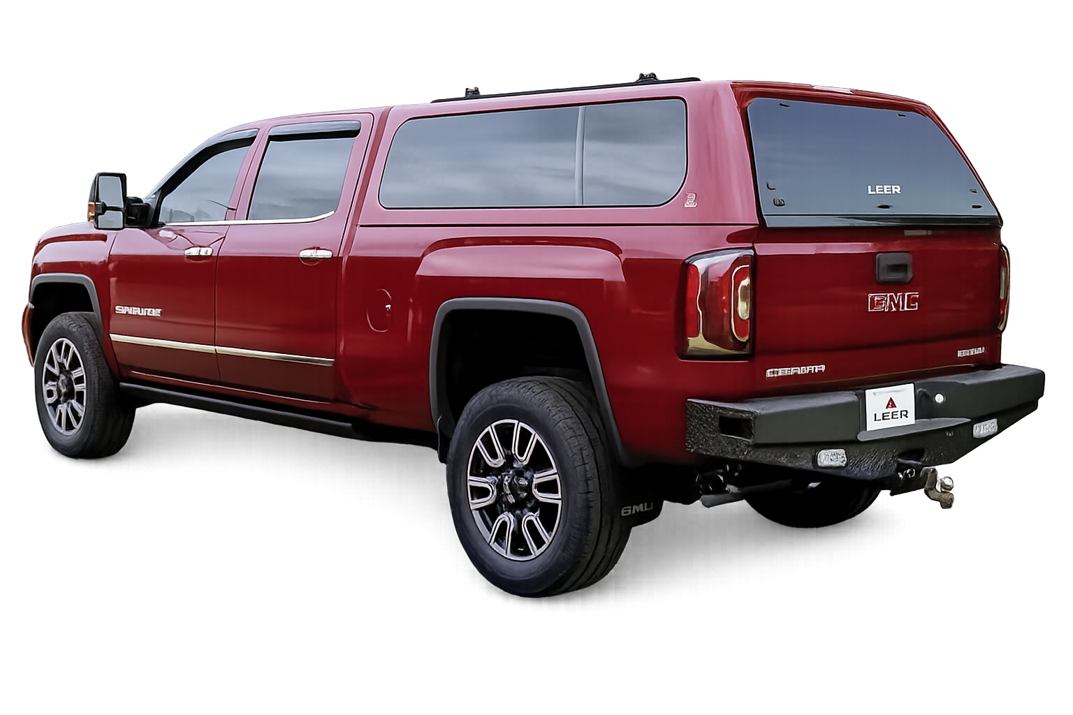 Red GMC pickup with a LEER 100XL fiberglass truck cap