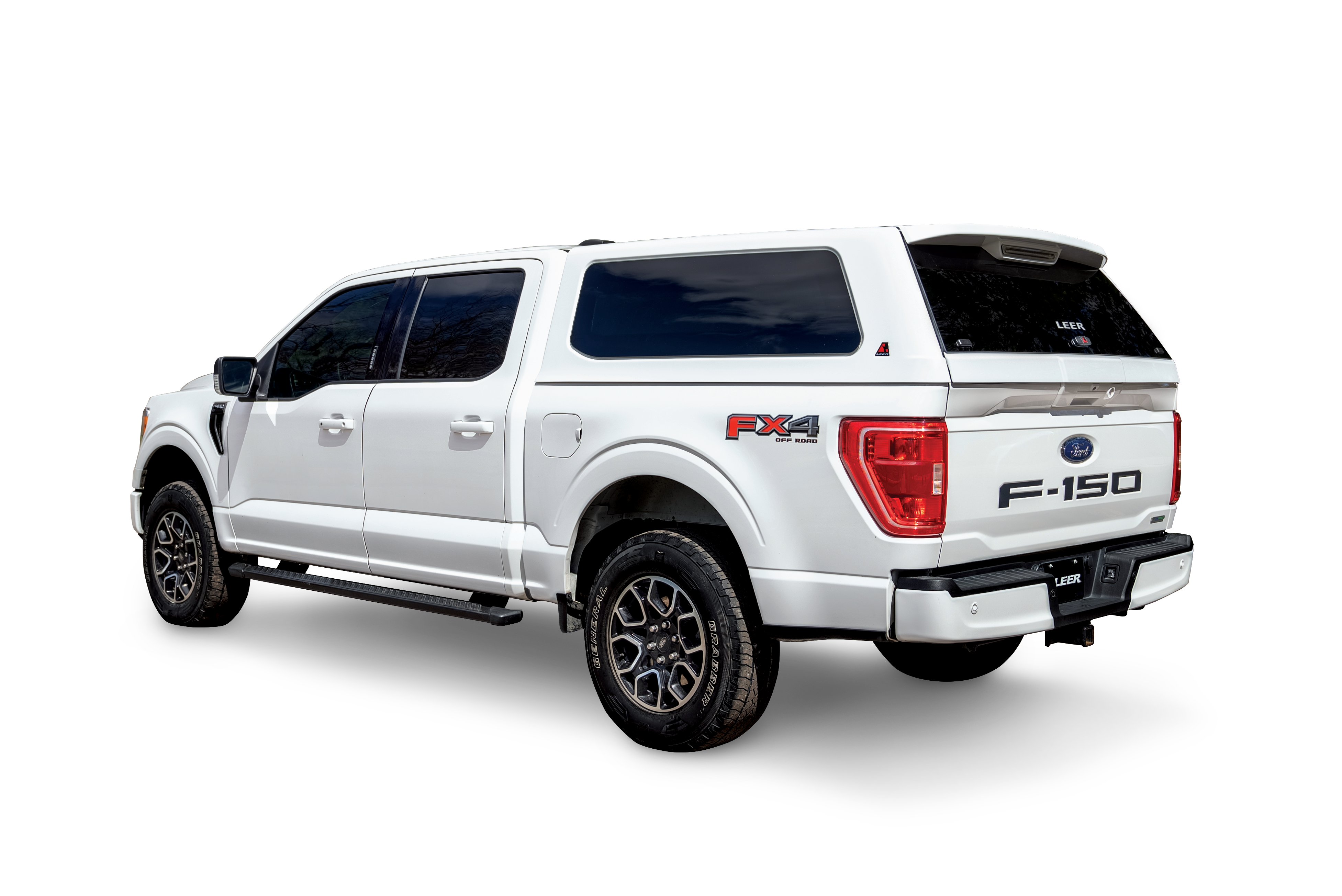 White Ford F-150 with a LEER 100XQ Sport fiberglass truck cap