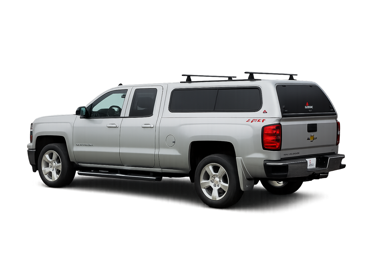 Silver Chevrolet pickup with a LEER 100XR fiberglass truck cap