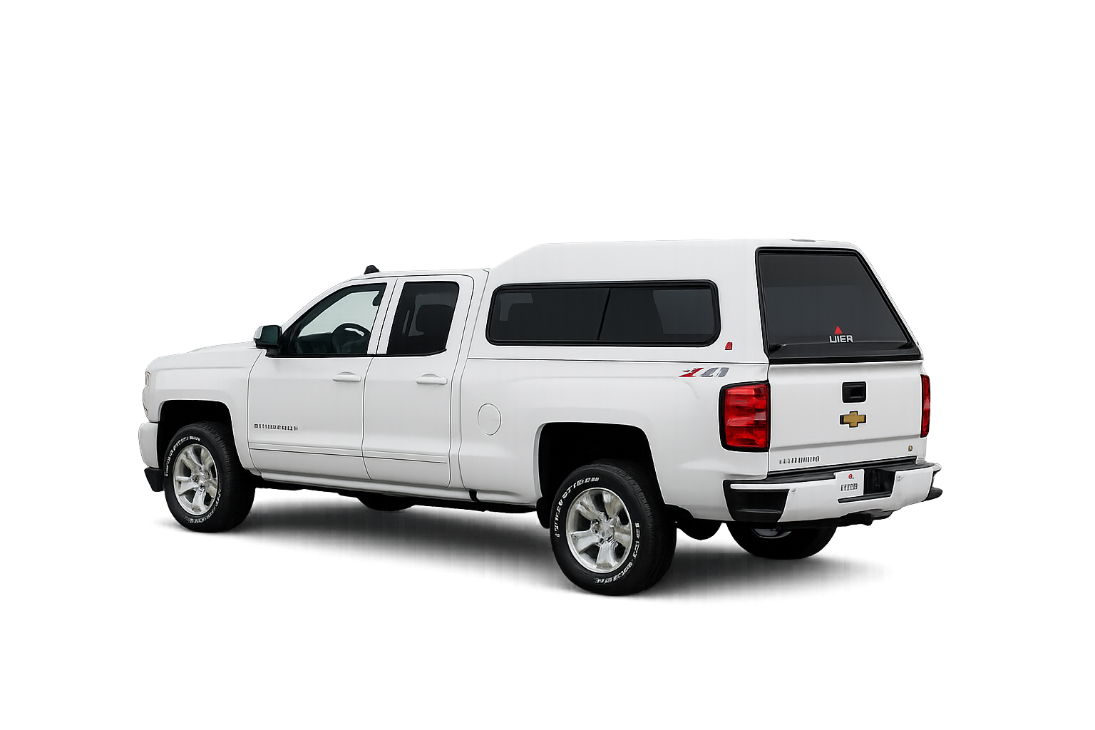 White Chevrolet pickup with a LEER 180 fiberglass truck cap